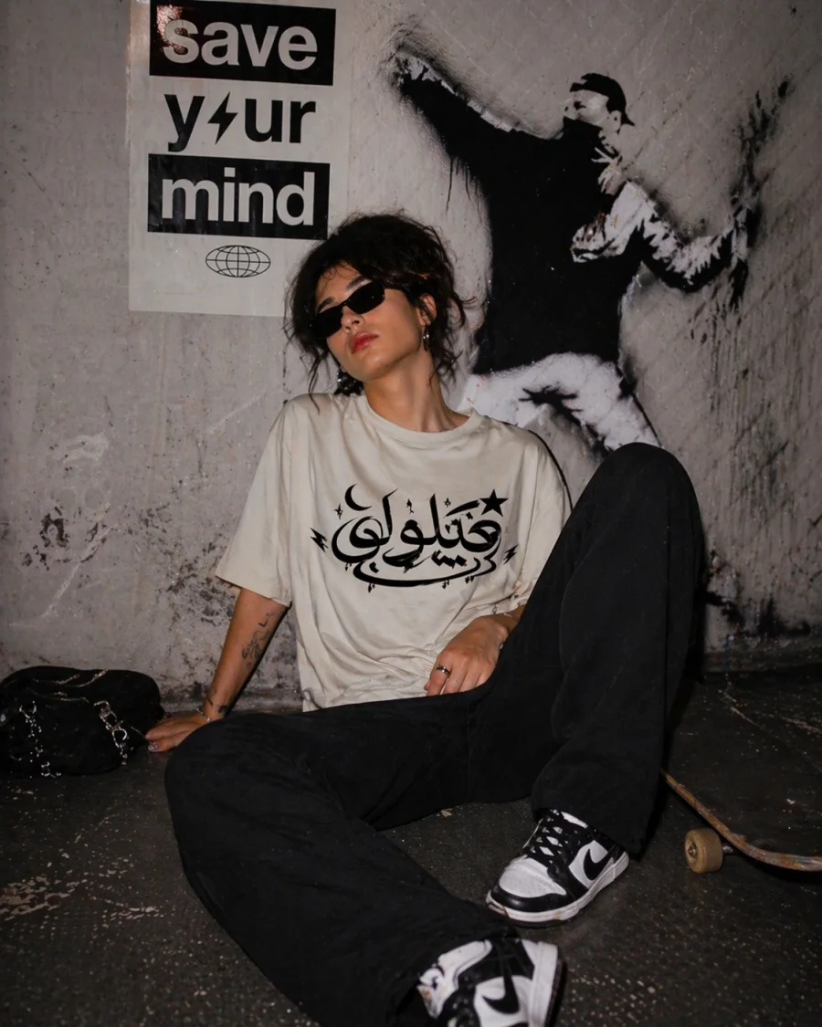 Delulu Retro Arabic Graphic Tee from the Forever Collection featuring vintage-inspired typography.